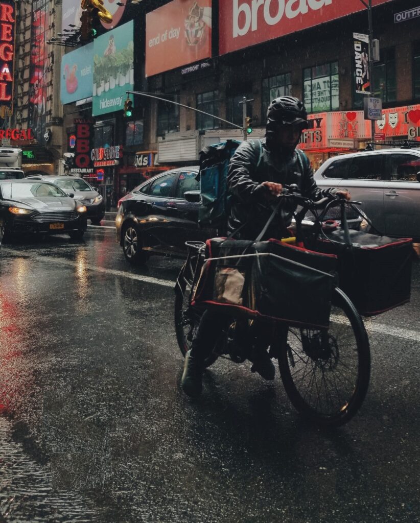 BAM! Be A Man. Man On Bicycle In The Rain.