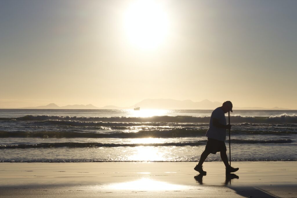 BAM! Be A Man. Man Alone Walking On Beach.